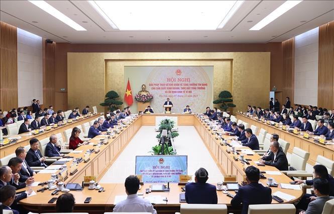 Hội nghị giải pháp tháo gỡ khó khăn về tăng trưởng tín dụng cho sản xuất kinh doanh. Ảnh: Dương Giang/TTXVN