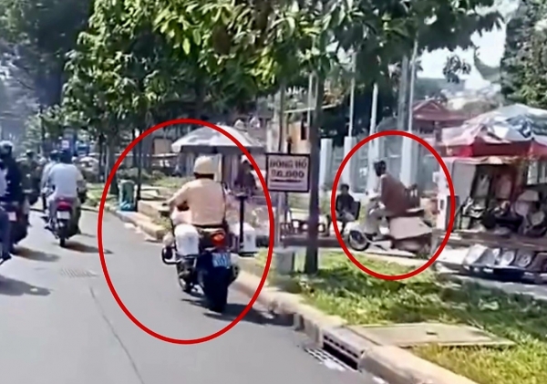 TP. Hồ Chí Minh: Tạm đình chỉ công tác đồng chí CSGT dùng chân đạp xe máy của người vi phạm
