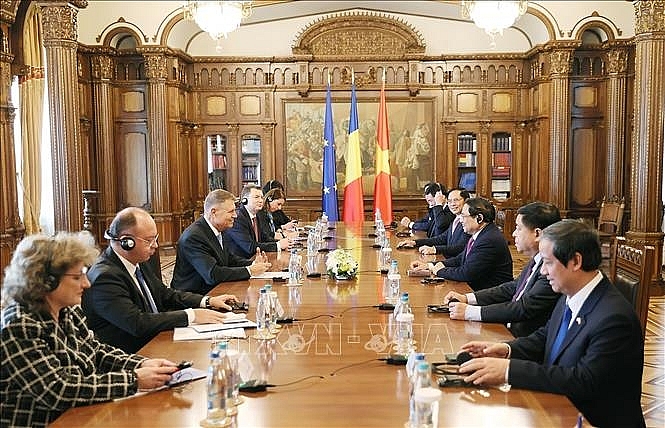 Thủ tướng Phạm Minh Chính hội kiến Tổng thống Romania Klaus Iohannis. Ảnh: Dương Giang/TTXVN