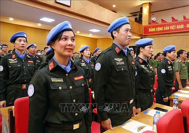 Các sĩ quan công an đi thực hiện nhiệm vụ gìn giữ hòa bình Liên hợp quốc tham dự buổi lễ. Ảnh: Phạm Kiên/TTXVN