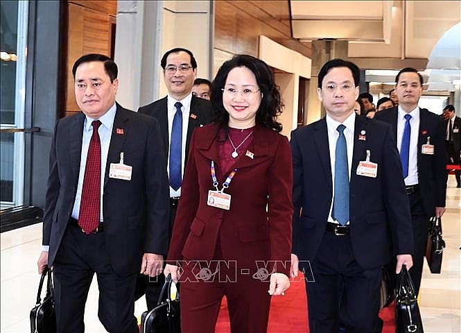 Các đại biểu đến dự ngày làm việc thứ ba Đại hội XIII của Đảng. Ảnh: TTXVN