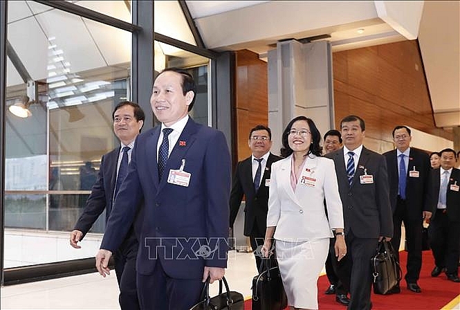 Các đại biểu đến dự ngày làm việc thứ ba Đại hội XIII của Đảng. Ảnh: TTXVN