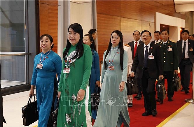 Các đại biểu đến dự ngày làm việc thứ ba Đại hội XIII của Đảng. Ảnh: TTXVN