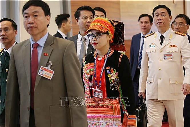 Các đại biểu đến dự ngày làm việc thứ ba Đại hội XIII của Đảng. Ảnh: TTXVN