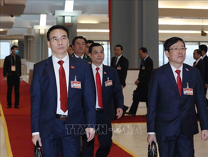  Các đại biểu đoàn Đảng bộ tỉnh Vĩnh Phúc đến dự phiên họp sáng 30/1. Ảnh: TTXVN