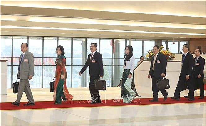 Các đại biểu đến dự phiên họp sáng 30/1. Ảnh: TTXVN