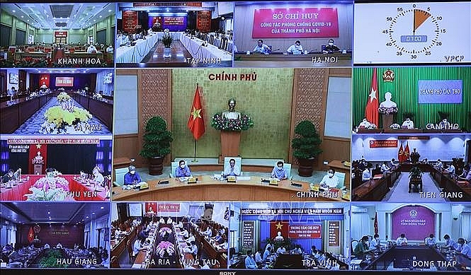 Cuộc họp tại điểm cầu các địa phương. Ảnh: Dương Giang/TTXVN