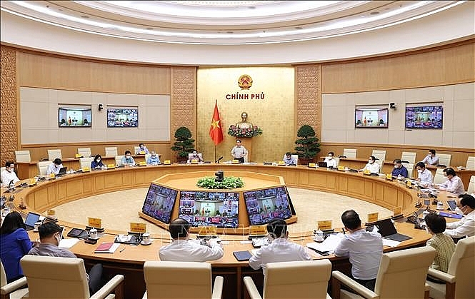 Quang cảnh cuộc họp tại điểm cầu Chính phủ. Ảnh: Dương Giang/TTXVN