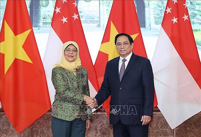 Thủ tướng Phạm Minh Chính tiếp Tổng thống Cộng hòa Singapore Halimah Yacob, chiều 17/10. Ảnh: Dương Giang/TTXVN