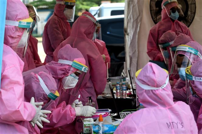 X&eacute;t nghiệm COVID-19 tại Indonesia. Ảnh: AFP/TTXVN